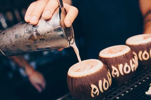 Bartender pouring using strainer White healthy Cocktail drink on a bar counte Stock Photos