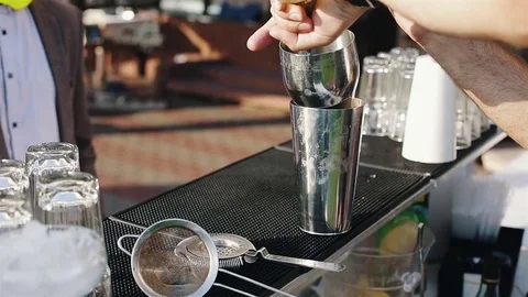 The bartender pours alcoholic ingredients for mixing Stock Footage 73754966