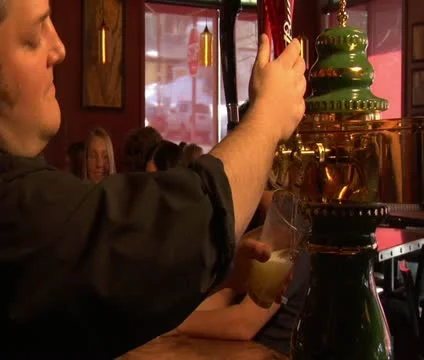 Bartender pours beer Stock Footage 21636302