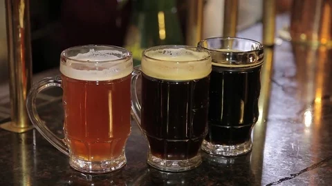 The bartender pours a beer in a mug Stock Footage 80638103