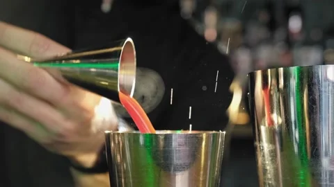 Bartender pours blue liquid into shaker Stock Footage 170233113