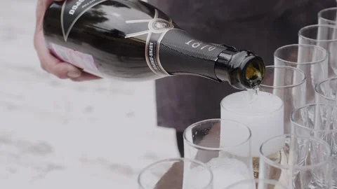 A bartender pours champagne into glasses 스톡 동영상 170196293