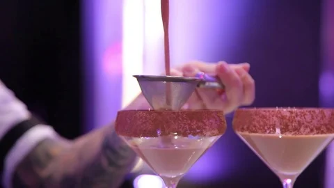 The bartender pours the cocktail into the glass Video stock 82108212