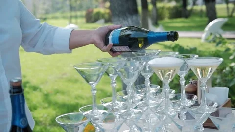 The bartender pours a cocktail into the glasses Stock Footage 149287666