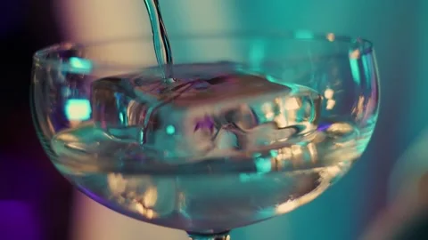 The bartender pours a cocktail with ice, close up Stock Footage 196981975
