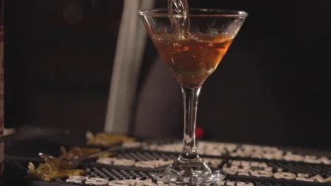 A bartender pours a cocktail in slow motion. Stock Footage 148102946