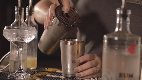 A bartender pours a craft cocktail. Stock Footage 148101006