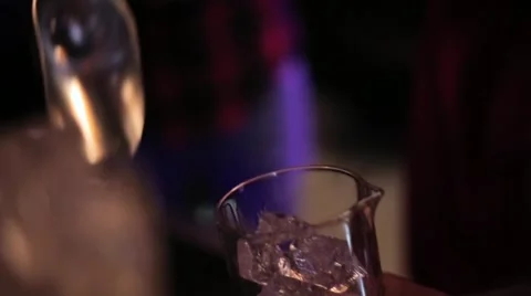 Bartender pours a glass of ice closeup Stock Footage 61838329