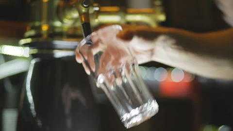 The bartender pours lemon beer. Video stock 93325772