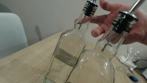 The bartender pours liqueur into the jigger. Slow motion Stock-Footage 134031835