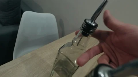 The bartender pours liqueur into the jigger. Slow motion Stock-Footage 134033976