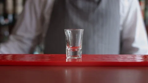 Bartender pours one shot of alcohol. Stock Footage 74218432