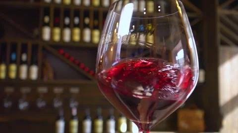 A bartender pours red wine into a glass. Stock Footage 258067804