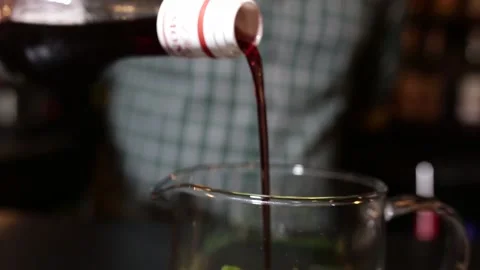 Bartender pours syrup into fruit tea. live camera Stock Footage 154911215