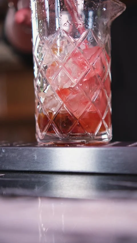 The bartender pours the syrup into a glass Stock Footage 310694567