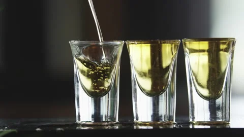 Bartender pours three shots at once Stock Footage 274627570