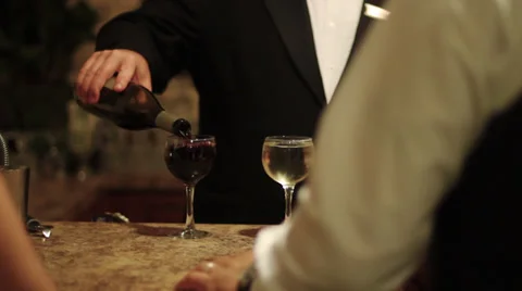 Bartender pours wine at event 動画素材 37586102