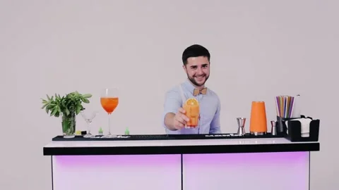 Bartender prepared alcohol cocktail with slice of orange in the glass Stock Footage 151417279