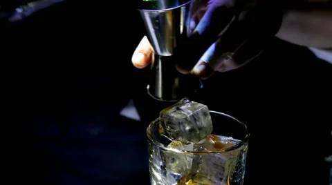 Bartender prepares alcoholic drink with ice Stock Footage 49467737