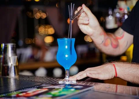 The bartender prepares a blue cocktail for serving. anapa city 2022 august 22 Stock Photos