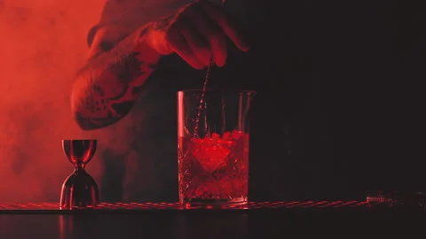 Bartender prepares a cocktail at the bar Stock Footage 167383942