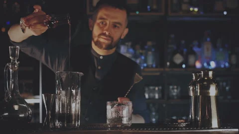 Bartender prepares a cocktail at the bar Stock Footage 167390231
