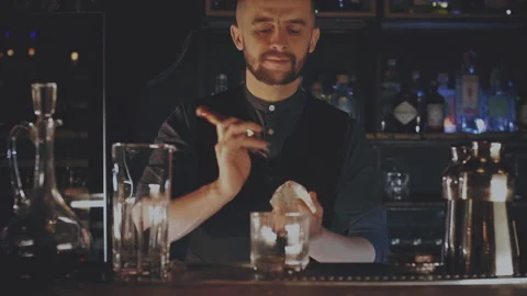 Bartender prepares a cocktail at the bar Stock Footage 167390270