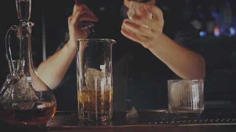 Bartender prepares a cocktail at the bar Stock Footage 167579234