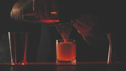 Bartender prepares a cocktail at the bar Stock Footage 168373932