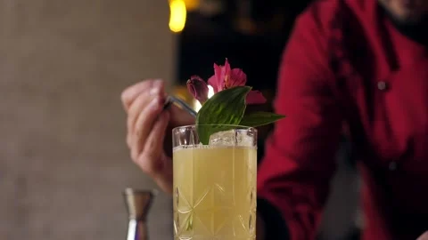 The bartender prepares a cocktail in the bar of the restaurant. Stock Footage 240242116