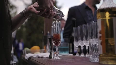 Bartender prepares a cocktail outside Video stock 220377538