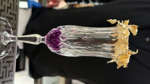 Bartender prepares a cocktail, pour water into a Crystal Glass. The glass is Stock Footage 246474520
