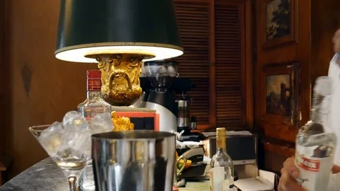 Bartender prepares a cocktail at the Spies Bar within the Hotel Palacio, Estoril Stock Footage 106098608