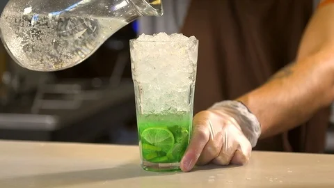 Bartender prepares a cold drink 120 fps Stock Footage 97328619