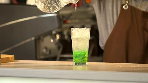 Bartender prepares a cold drink 120 fps Stock Footage 97328638