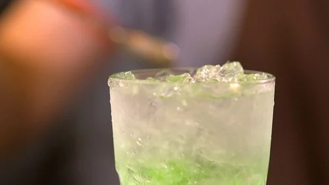 Bartender prepares a cold drink 120 fps Stock Footage 97328652