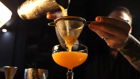 The bartender prepares a delicious cocktail Stock Footage 137490354