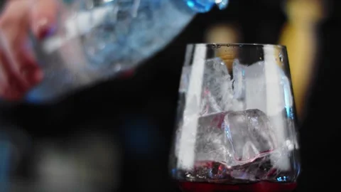 The bartender prepares a drink at the bar. Slow-mo. Close-up Stock Footage 131151902