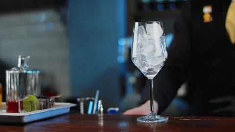 The bartender prepares a drink at the bar. Slow-mo. Close-up Stock Footage 131151913