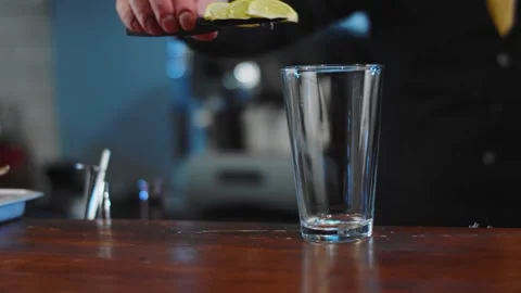 The bartender prepares a drink at the bar. Slow-mo. Close-up Stock Footage 131151930