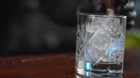 The bartender prepares a drink at the bar. Slow-mo. Close-up Stock Footage 131152020