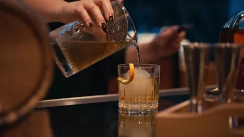 Bartender prepares elegant smoked old fashioned cocktail whiskey drink smoker Stock Footage 280507773