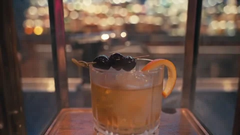 Bartender prepares elegant smoked old fashioned cocktail whiskey drink smoker Video stock 280507791