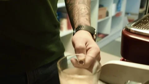 The bartender prepares a milkshake. The process of making coffee latte. Stock Footage 147149073