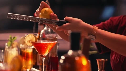 Bartender prepares modern cocktail in martini glass cinematic Video stock 280508383