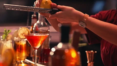 Bartender prepares modern cocktail in martini glass cinematic Video stock 280508388