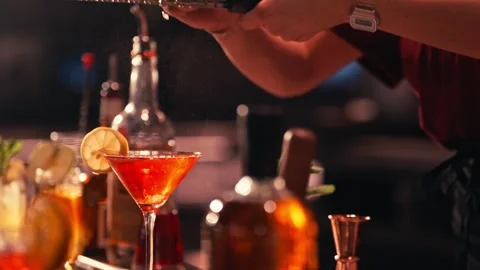 Bartender prepares modern cocktail in martini glass cinematic Video stock 280508415