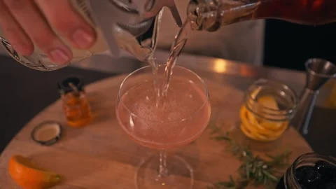 Bartender prepares modern cocktail in martini glass with garnish cinematic Vidéo 280514704