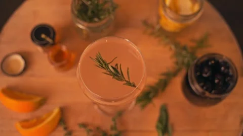 Bartender prepares modern cocktail in martini glass with garnish cinematic Видео 280514714