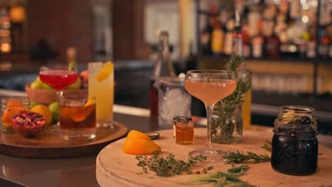 Bartender prepares modern cocktail in martini glass with garnish cinematic Vídeos de archivo 280514721
